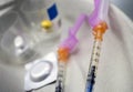 Syringes loaded with medication next to medicine vials prepared in hospital