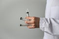 Syringes and money in doctor's hands