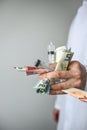 Syringes and money in doctor's hands