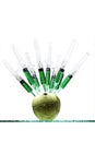 Syringes stuck in an apple Royalty Free Stock Photo