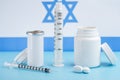 Coins stacked on each other in different positions on colored background. Pharmaceutical industry in Israeli