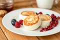 Syrniki cottage cheese fritters with berries