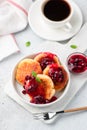 Syrniki, cottage cheese fritters with berry sauce