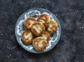 Syrniki - delicious breakfast, snack on a dark background, top view. Cottage cheese pancakes Royalty Free Stock Photo