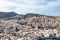 Syros island, Greece, aerial drone view. Ermoupolis and Ano Siros town cityscape, cloudy blue sky background