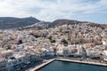 Syros island, Greece, aerial drone view. Ermoupolis and Ano Siros town cityscape, cloudy blue sky background