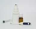 Syrup, spray, thermometer, face mask and syringe