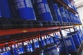 System of address storage of products, materials and goods in a warehouse. blue plastic barrels for storage of chemical liquids. Royalty Free Stock Photo