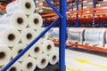 System of address storage of products, materials and goods in a warehouse. Rolls of polyethylene film in stock.