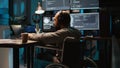 System admin using terminal window on laptop to program new code