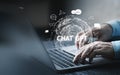 System Artificial intelligence chatbot , Businessman using Laptop or Smartphone With ChatGPT Chat Bot AI , Technology smart robot