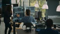 System engineer checking code on multiple monitors and working with app developer Royalty Free Stock Photo