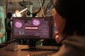 System hacked warning on screen, computer database access
