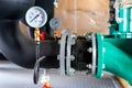 System of hot water pipes with manometer in boiler room Royalty Free Stock Photo