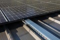 Mounted on the roof of the building solar panels for trapezoidal sheet metal. Royalty Free Stock Photo