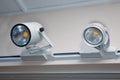 The system runs suspended from the ceiling on the rail. The head of the spotlight is capable of rotating in the desired direction Royalty Free Stock Photo