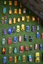 Systematic arrangement of beautiful toy cars on green grass