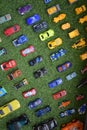 Systematic arrangement of beautiful toy vehicles on green grass