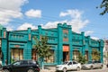 Syzran`, Russia - August, 16,2016: Household goods store in bright turquoise beautiful unusual shape building.