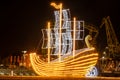 SZCZECIN, WEST POMERANIAN / POLAND - 2018: The marina quays with a decorative neon yacht and a view of the illuminated residential