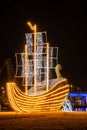 SZCZECIN, WEST POMERANIAN / POLAND - 2018: The marina quays with a decorative neon yacht and a view of the illuminated residential