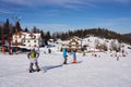 Skiers on slope in european Bialy Krzyz in Poland