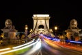 Szechenyi Chain Bridge with colorful light trails by night in the city of Budapest, Hungary Royalty Free Stock Photo