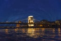 Szechenyi Chain Bridge illuminated by illumination at night in the city of Budapest, Hungary Royalty Free Stock Photo