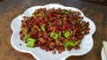 Szechuan style fried diced chicken with dried red chili and green chili peppers Royalty Free Stock Photo