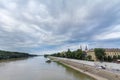 Szeged city center seen from Tisza river, with a highlight on Szeged Cathedral, seen into the light during sunset during afternoon