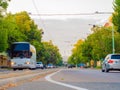 View on the roundabout with cars and trams passing on the street Boldogasszony boulevard