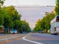 View on the roundabout with cars and trams passing on the street Boldogasszony boulevard