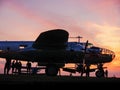 View on the airplanes on the Szeged Airport with the sunset in the background Royalty Free Stock Photo