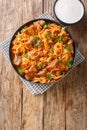 Szekely Gulyas or Szegedin goulash with pork, onions and sauerkraut in a paprika broth closeup  in the plate. Vertical top view Royalty Free Stock Photo