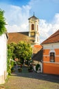 SZENTENDRE, HUNGARY - JULY 26, 2016: A paved street and a church in the center of Szentendre Royalty Free Stock Photo