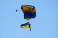 Paratrooper flying in the sky. Extreme sport and Xgames. Jumping with Ukraine flag. Royalty Free Stock Photo