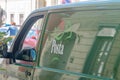 Logo and sign of Hungarian post Posta on green car