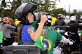 Juciane Cunha on the back of the motorcycle on the motorcycle with the president in the city of SÃÂ£o JosÃÂ© dos Campos