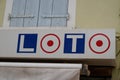 FDJ loto text logo brand La Francaise des Jeux loto advertising sign on shop facade