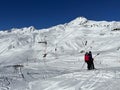 T-bar ski lift (Schlepplift mit T-BÃ¼gel-Anker) on the snowy slopes of the Swiss alpine winter resort of Arosa Royalty Free Stock Photo