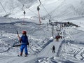 T-bar ski lift (Schlepplift mit T-BÃ¼gel-Anker) on the snowy slopes of the Swiss alpine winter resort of Arosa Royalty Free Stock Photo