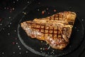 T-bone or aged wagyu porterhouse grilled beef steak with spices and herbs. Gourmet grilled and sliced porterhouse steak. Food Royalty Free Stock Photo