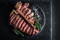 T bone steak is grilled sliced on a piece. Aged Barbecue Porterhouse Steak American meat restaurant served on slate board. banner