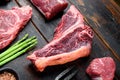 T bone steak. Organic raw Tbon beef marbled meat, on old dark wooden table background