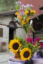 T bouquet of gerbera and sunflowers on old church background Royalty Free Stock Photo