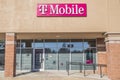 T-Mobile wall sign and entrance with covid-19 signs