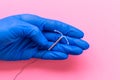 T-shaped intrauterine contraceptive device in gynecologist hand