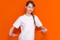 T-shirt design concept - smiling young with hair braid girl in blank white t-shirt pointing at herself