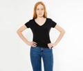 T-shirt design, happy people concept - smiling red hair woman in blank black t-shirt pointing her fingers at herself, red head Royalty Free Stock Photo