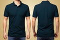 T-shirt design - young man in blank dark blue polo shirt from front and rear isolated Royalty Free Stock Photo